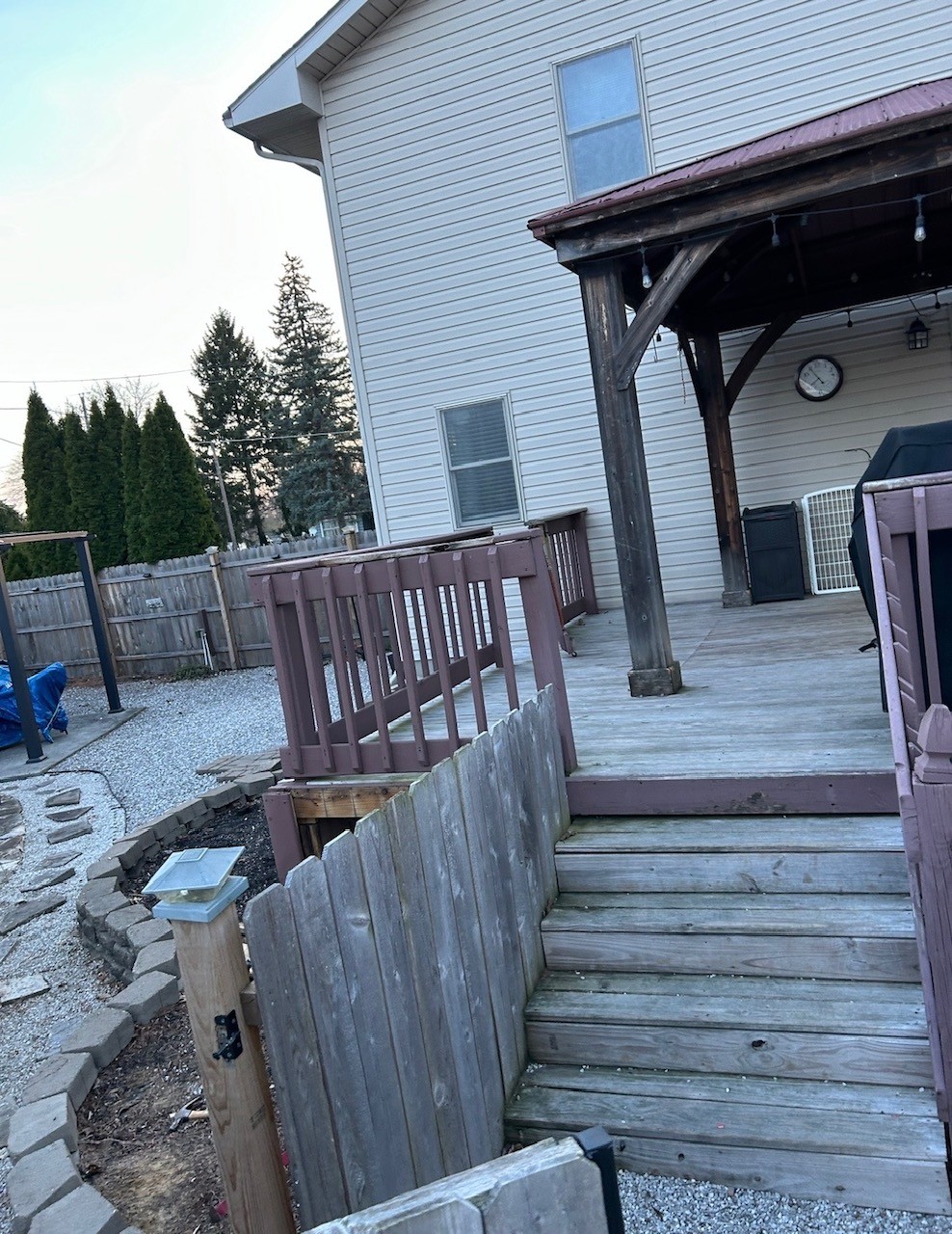 Before deck entry stairs with older purple railing.