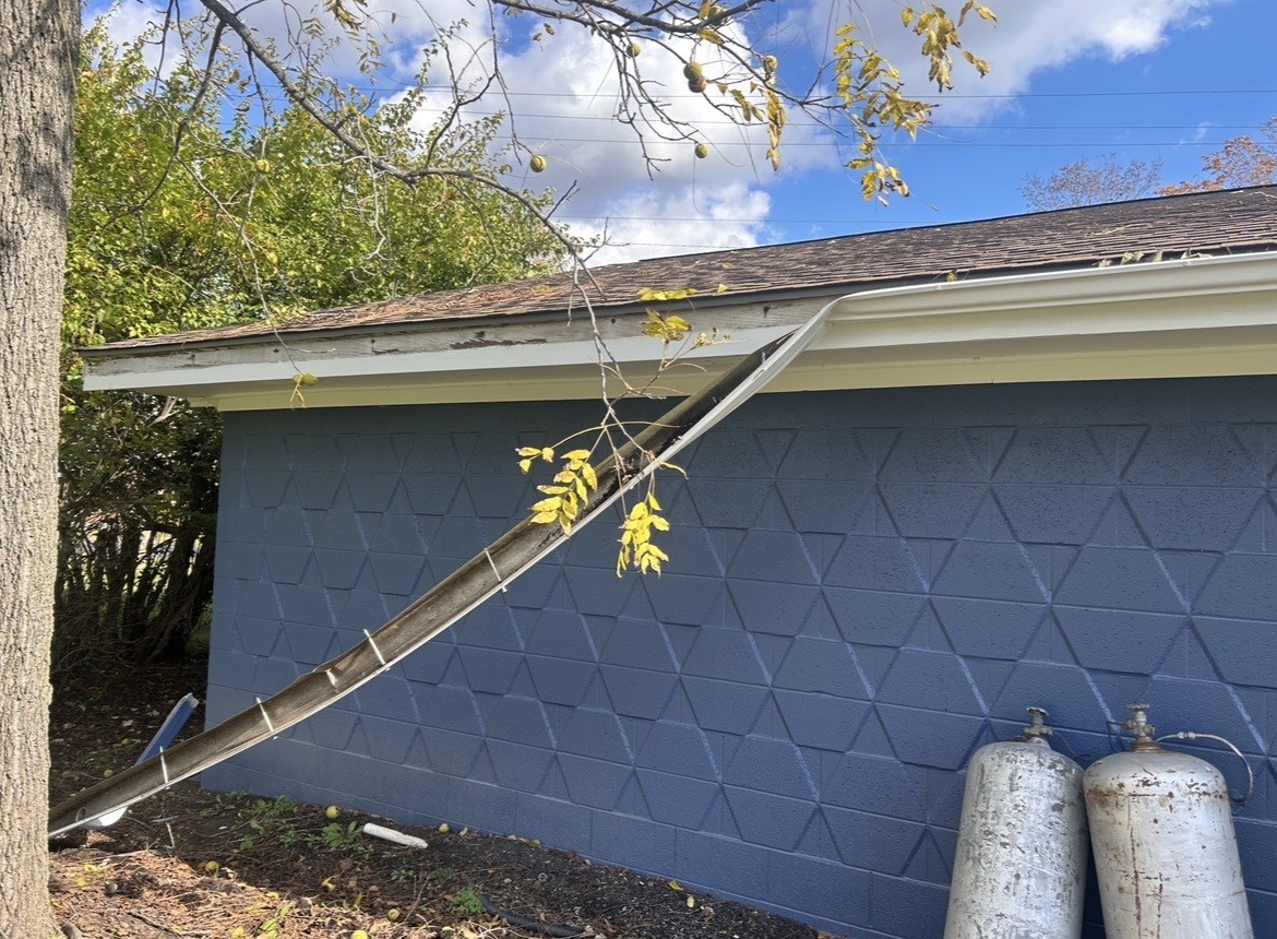 Before gutter and downspout repair.